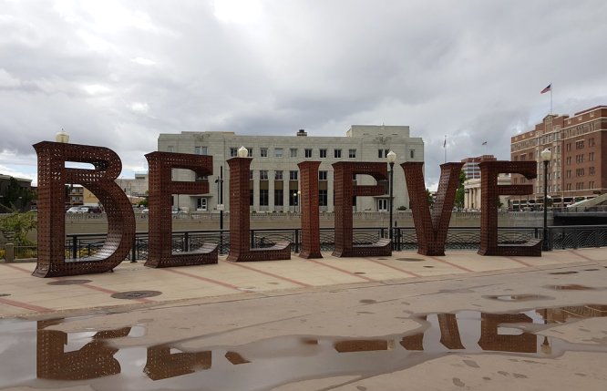 After moving around for a few years, the BELIEVE sign was permanently installed in City Plaza, directly opposite the US Post Office building (photo courtesy of Bruce)
