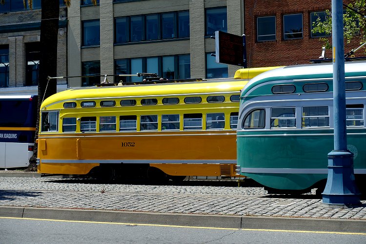 Two vintage streetcars make a colourful sight. One was parked up, while the other was on driver training duties, practising emergency stops!