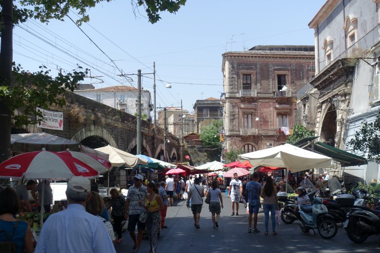 (A) CATANIA: The railway formed a solid boundary to the market area.
