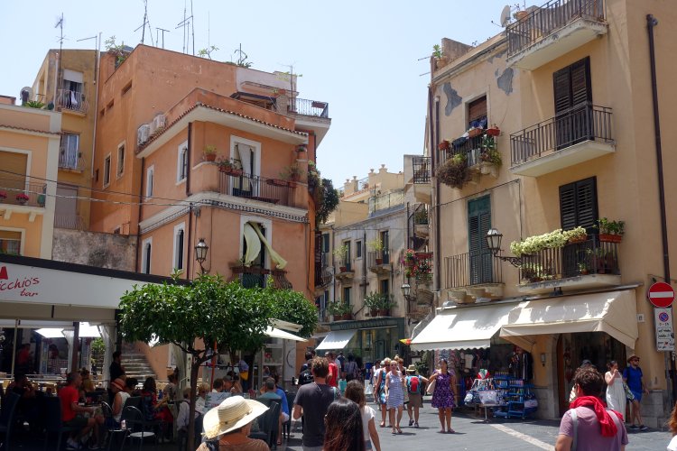 (C) TAORMINA: Along with many other visitors, we spent several hours strolling through the pretty streets and admiring the views.